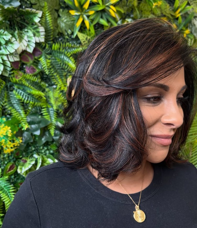 Layered brunette bob with warm highlights