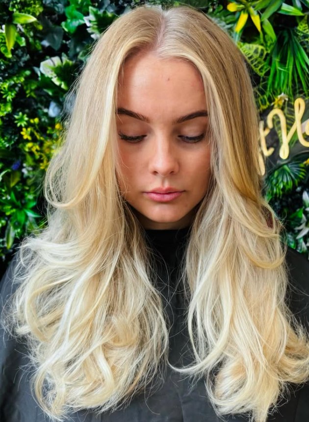 Bright blonde with soft waves at The Loft Hair Studio